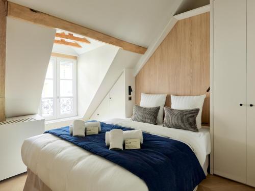 Ένα ή περισσότερα κρεβάτια σε δωμάτιο στο Luxury Flat in Le Marais