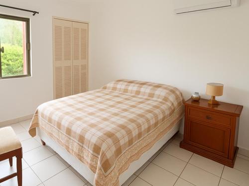 Ένα ή περισσότερα κρεβάτια σε δωμάτιο στο Departamento acogedor Hotel-Condominio Buganvillas