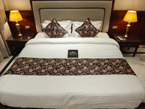 Ένα ή περισσότερα κρεβάτια σε δωμάτιο στο The Himalayan Residency