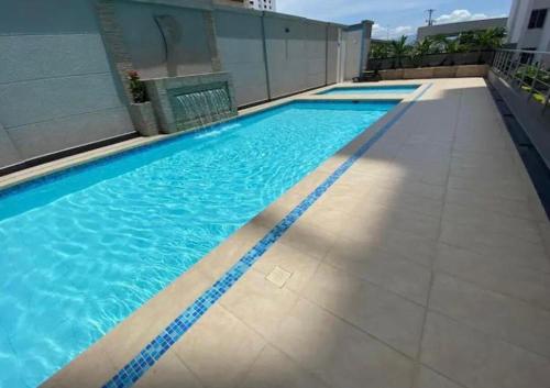a swimming pool on top of a building at Apartamentos Amoblados Confort Turismo en Cúcuta 1 in Cúcuta