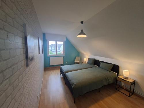 Ένα ή περισσότερα κρεβάτια σε δωμάτιο στο Le Clos des Embruns