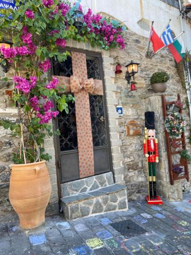 a door with a cross on the side of a building at Villa Aurelia Old Town in Kavala