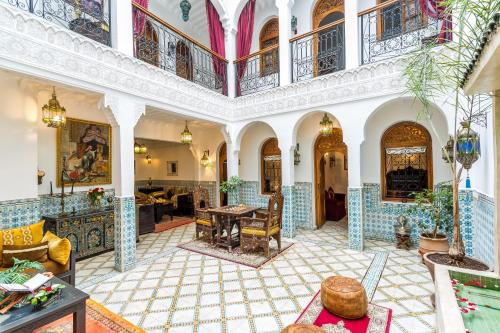 a large living room with a large ceiling at Riad Mouna in Marrakech