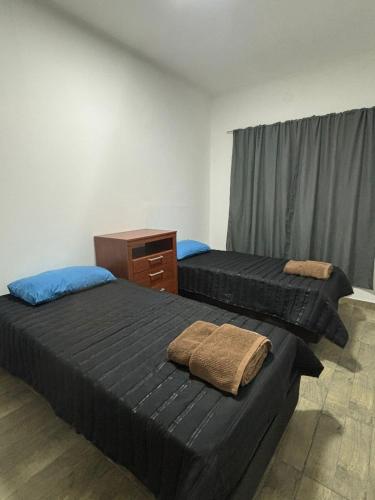 Ένα ή περισσότερα κρεβάτια σε δωμάτιο στο Departamento Doña Elba