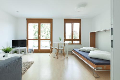 Postel nebo postele na pokoji v ubytování Lovely 1 room apartment near Basel