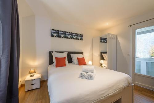 En eller flere senge i et værelse på La Source du Lac - Plage privée