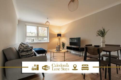 a living room with a couch and a table at Shaw Apartment in Glasgow