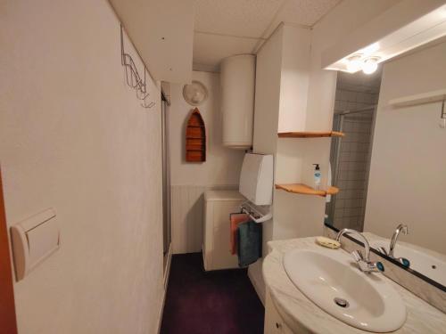 a bathroom with a sink and a toilet at La Fontaine- Douceur, Centre Historique et Charme in Plombières-les-Bains