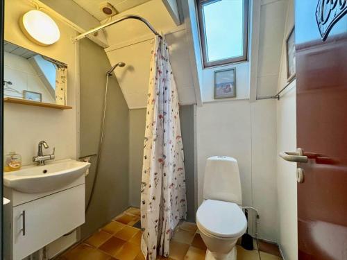 a small bathroom with a toilet and a sink at M398-Gedser-Gedser-Feriepark-32 in Gedser