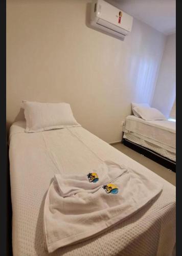 Ένα ή περισσότερα κρεβάτια σε δωμάτιο στο Boas vindas