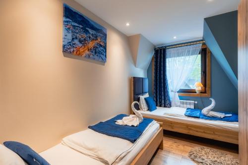 Camera con 2 Letti e TV a parete di Rolicek 4 Seosons Apartments a Zakopane