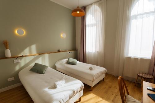 Ένα ή περισσότερα κρεβάτια σε δωμάτιο στο Hotellerie de l'Abbaye du Désert