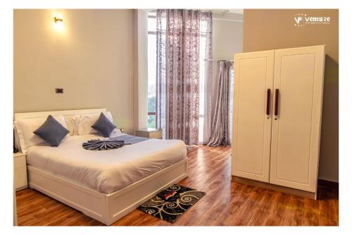 Ένα ή περισσότερα κρεβάτια σε δωμάτιο στο Daros International Hotel