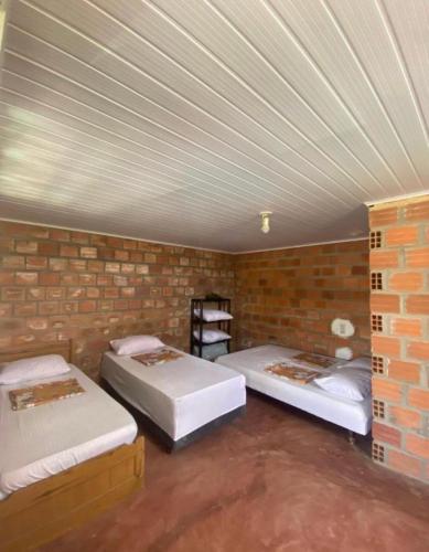 Ένα ή περισσότερα κρεβάτια σε δωμάτιο στο Casa em Itamaracá