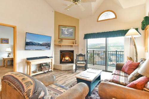 a living room with a couch and a fireplace at Lake Forest Summit Condo: Great Penthouse Views in Summit Medical Center Heliport