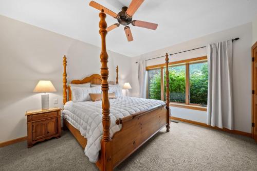a bedroom with a bed and a ceiling fan at Chetola: Sierra 1 in Blowing Rock