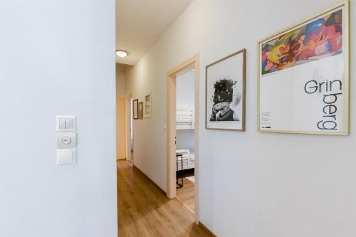 a hallway with two pictures on the wall and a room at Monemvasia modern flat nearby sea in Monemvasia