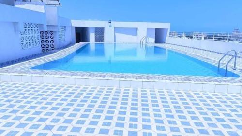 a large swimming pool on top of a building at Zivora Hotel And Restaurant in Mombasa