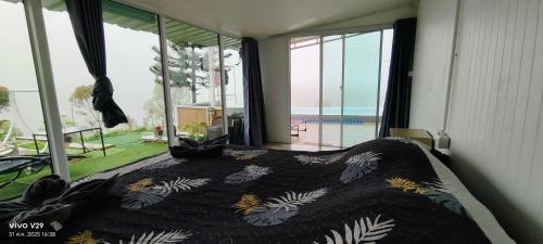 Ένα ή περισσότερα κρεβάτια σε δωμάτιο στο โกโรโกโสเขาค้อ