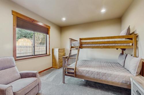 a bedroom with a bunk bed and a chair at No. 3 Coal Mine Cabin in Ronald