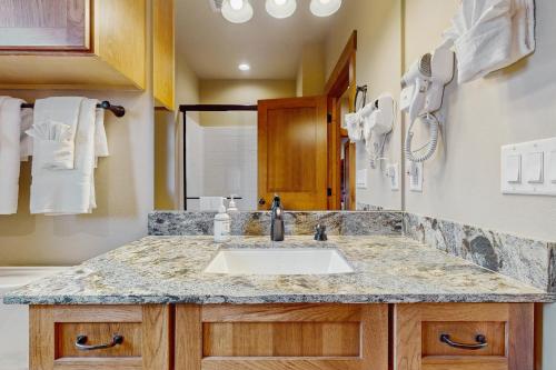 a bathroom with a sink and a counter at No. 3 Coal Mine Cabin in Ronald