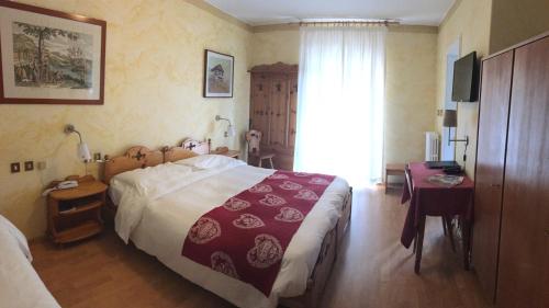 Postel nebo postele na pokoji v ubytování Meuble Villa Neve