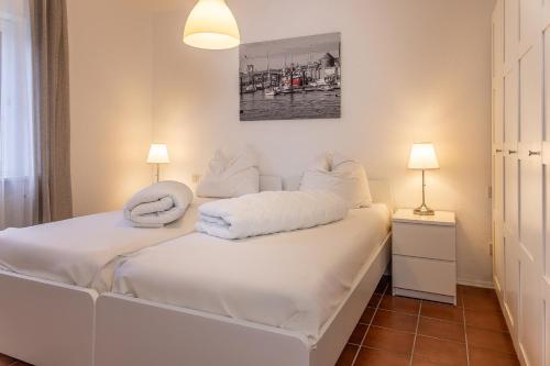 Ένα ή περισσότερα κρεβάτια σε δωμάτιο στο Haus Harle 50201 Ferienwohnung Harle 1