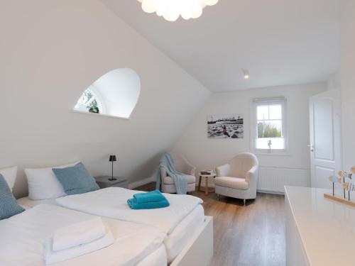 Postel nebo postele na pokoji v ubytování Ferienhaus Deich Huus