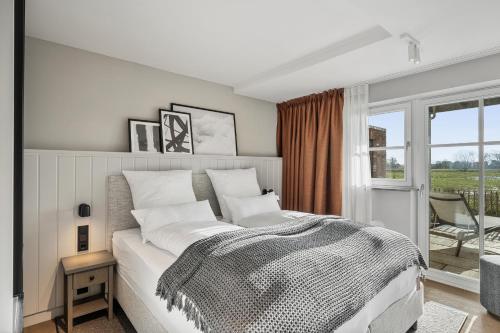 Ένα ή περισσότερα κρεβάτια σε δωμάτιο στο Alte Schule Westerhever Osterhever