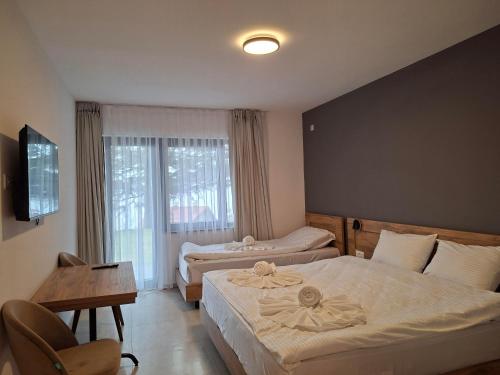 Ένα ή περισσότερα κρεβάτια σε δωμάτιο στο Hotel Belica