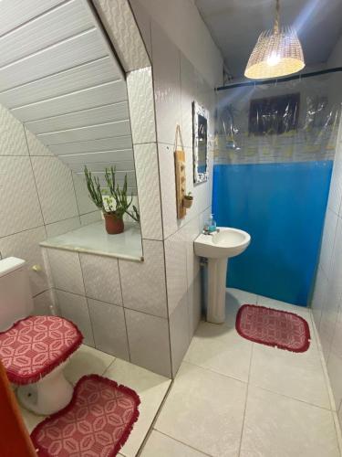 a small bathroom with a sink and a toilet at Xicabacana in Mata de Sao Joao