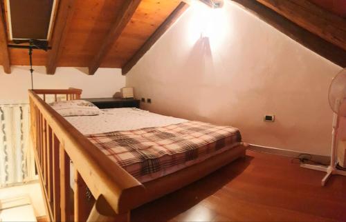 a bedroom with a bed in a room at La casa degli Elfi a Monfalcone in Monfalcone