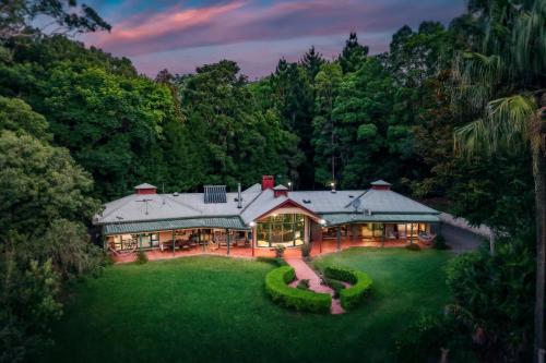 an aerial view of a large house in the forest at Evermoore Homestead in Gleniffer