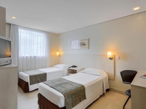 Ένα ή περισσότερα κρεβάτια σε δωμάτιο στο ibis Styles Belem Batista Campos