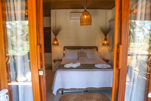 Letto o letti in una camera di Villa Loui Beach Icaraizinho-Ce