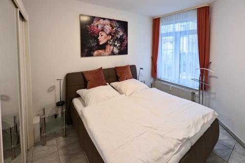 Postel nebo postele na pokoji v ubytování Ferienwohnung im Kurviertel 504