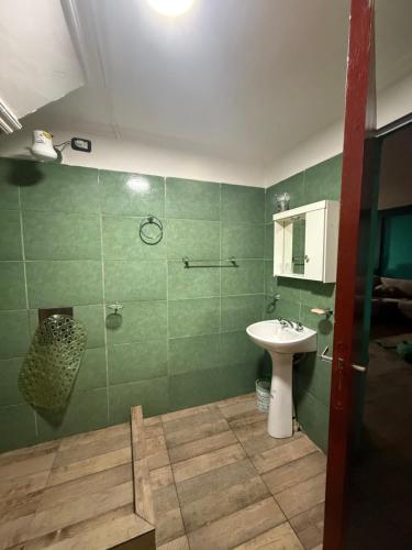 a bathroom with a sink and a shower and a toilet at Quinta La Ramona in Candelaria