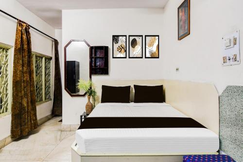 Ένα ή περισσότερα κρεβάτια σε δωμάτιο στο Hotel O Akash Namostay