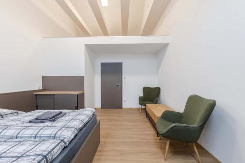 Un pat sau paturi într-o cameră la Rezidence Novosadská