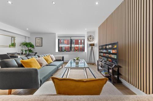 a living room with a couch and a table at Luxury Two Bedroom Living - Central London & Westminster in London