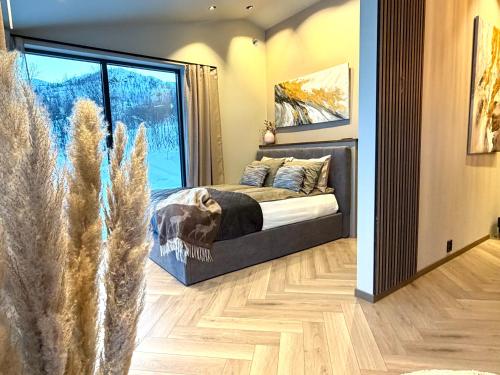 Ένα ή περισσότερα κρεβάτια σε δωμάτιο στο Aurora Suite