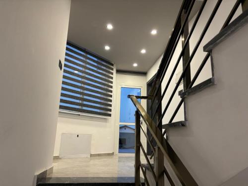 a staircase in a house with a window at Veray Homes Villa in Ayios Dhometios