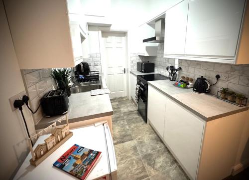 Køkken eller tekøkken på Cozy Catherdral View