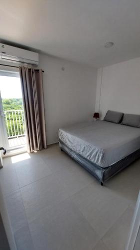 Ένα ή περισσότερα κρεβάτια σε δωμάτιο στο Departamento Amoblado de 2 dormitorios Zona Aeropuerto