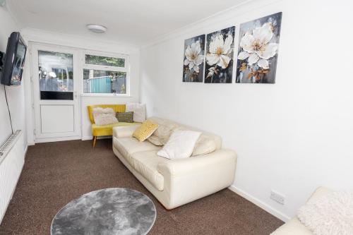 a living room with a couch and a table at Home from Home in Leicester