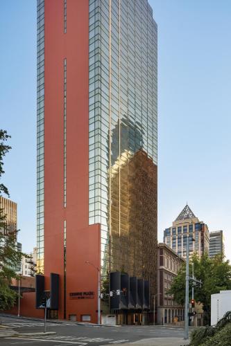 a tall glass building in a city at Crowne Plaza Seattle - No Resort Fee - Newly Renovated IHG Hotel in Seattle