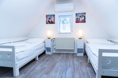 Un pat sau paturi într-o cameră la Landhaus Ruheoase - dennoch mittendrin