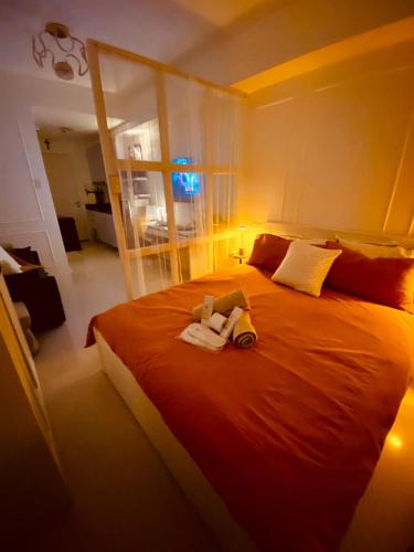 a bedroom with a bed with two stuffed animals on it at ASV Condo Staycation SMDC Breeze in Manila