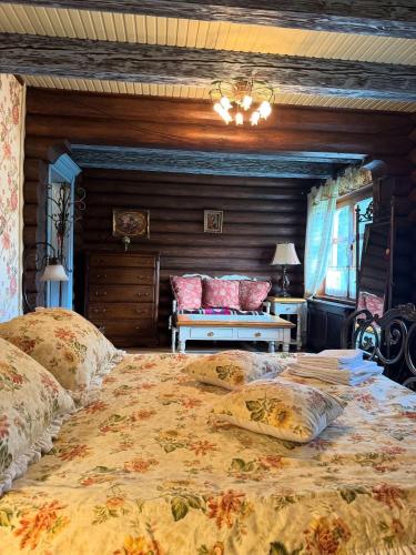 a bedroom with a large bed with pillows on it at Villa Anna in Guta