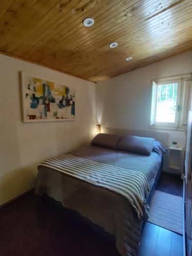 En eller flere senge i et værelse på Las Flores, casa del cerro